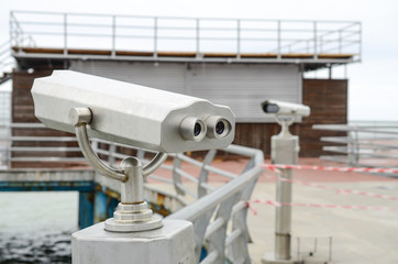 gray binoculars for viewing, seacoast