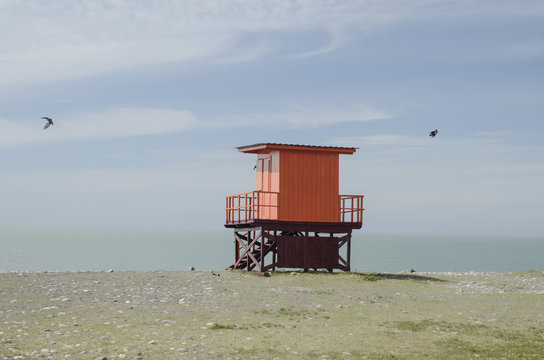 wooden lifeguard hut on an empty morning beach