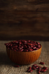 Bowl of red haricot beans on sackcloth. Stock image