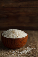 Fototapeta na wymiar Bowl of rice on sackcloth. Stock image