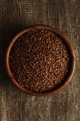 Bowl of buckwheat on sackcloth. Stock image