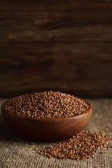 Bowl of buckwheat on sackcloth. Stock image