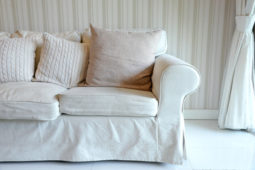 Living room with white sofa and curtain