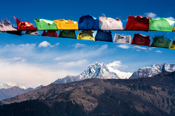 colorful prayer flags on annapurna background