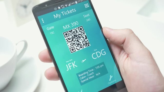 Viewing a plane boarding pass on smartphone screen.
