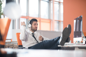 relaxed young business man at office