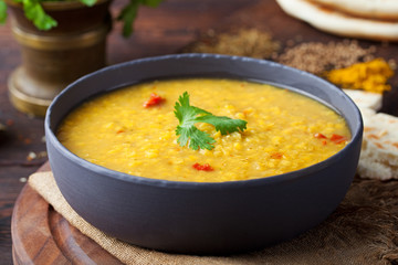 Red lentil Indian soup with flat bread Masoor dal - obrazy, fototapety, plakaty