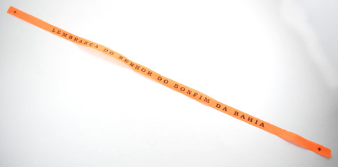 Brazilian ribbon (Lembran&ccedil;a do Senhor do Bonfim da Bahia) from Salvador, Bahia used to tie around wrist three times and make 3 wishes. Translation: Reminder of our Sir of Bonfim of Bahia
