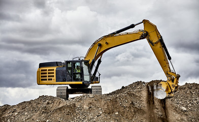 Constuction industry excavator heavy equipment digging gravel