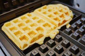 Making waffles on the waffle iron