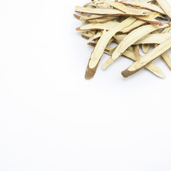 Isolated dried liquorice roots on white background