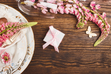 Tableware with pink Lupinus and silverware
