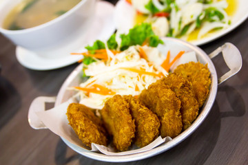 fried shrimp meat ball with sweet sauce on wooden table