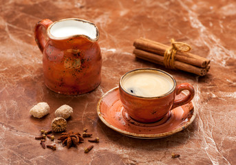 cup coffee espresso, milk and spices