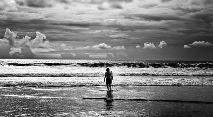 Men surfer and ocean. Black-white fine art photo.