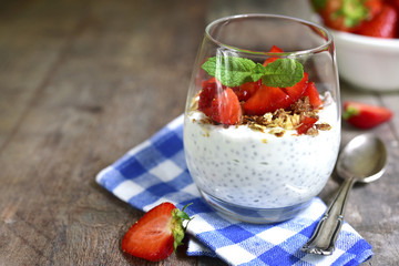 Chia seed pudding with strawberry and granola.