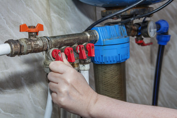 Household water supply unit, valves blocking access to pipes.