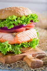 Closeup of delicious sandwich with big fish and vegetables