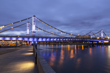 Fototapeta na wymiar Krymsky Bridge or Crimean Bridge at night is a steel suspension bridge in Moscow, Russia