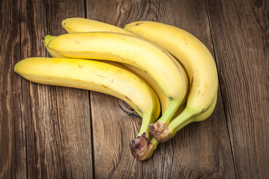 Bananas on a wooden background.