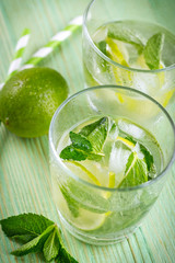 Lemonade drink on a wooden background
