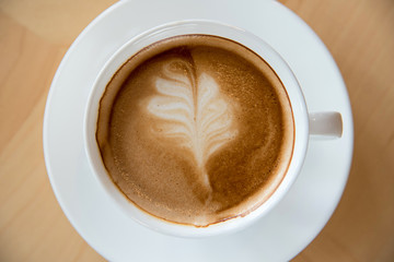 white coffee cup on wooden table