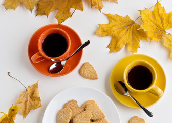 Autumn. Two cups of coffee and cookies in the shape of the leave