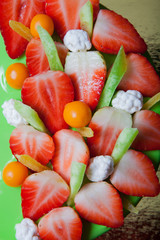 Many fresh berries on bright mousse cake