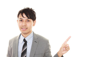 指示する笑顔のビジネスマン