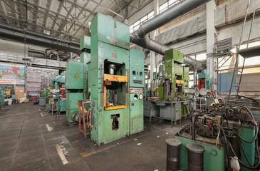 Fototapeta na wymiar Machinery plant. Workshop for production of thermoplastic parts. Hydraulic presses