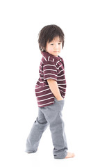 Little asian preschool boy standing isolated on white background