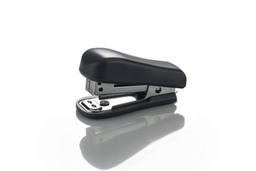 Stapler paper isolated with reflection on a white background