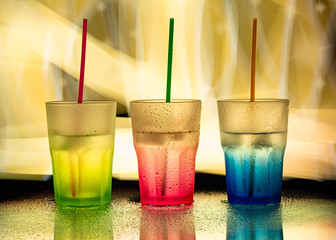 colored glasses on yellow background 