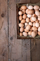 chicken eggs in a wooden box