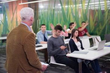 teacher with a group of students in classroom