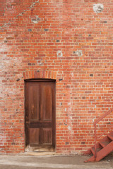 Timber door in red brick building