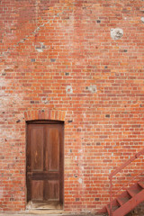 Timber door in red brick building