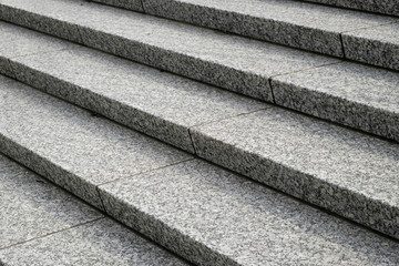 Diagonal close up of granite stairs as a background
