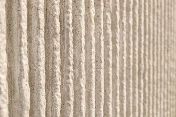 Section of wall, dirty white vertical pattern
