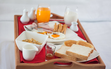 Breakfast set in wooden tray
