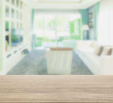 wooden table top with blur of living room in modern classic style