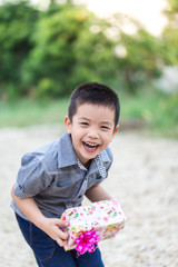 Child holding Christmas gift box