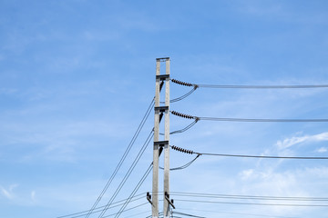 Electrical poles with white cloud and blue sky