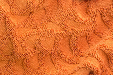 Texture of oval shape orange cotton bath towel