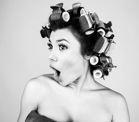 Emotional Girl with hair-curlers on her head