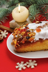 Fototapeta na wymiar Fruitcake with dried fruits and nuts in christmas setting