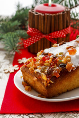 Fruitcake with dried fruits and nuts in christmas setting