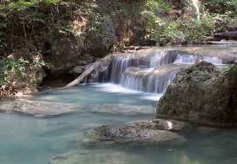 Fototapeta na wymiar Green Waterfall in Tropical Rainforest 