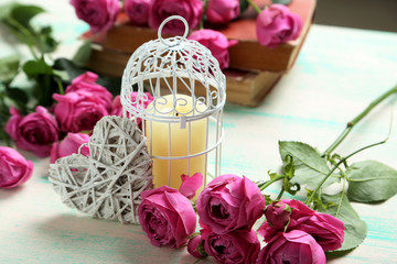 Beautiful pink roses on a mint wooden table