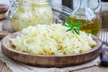 Homemade sauerkraut on a wooden plate